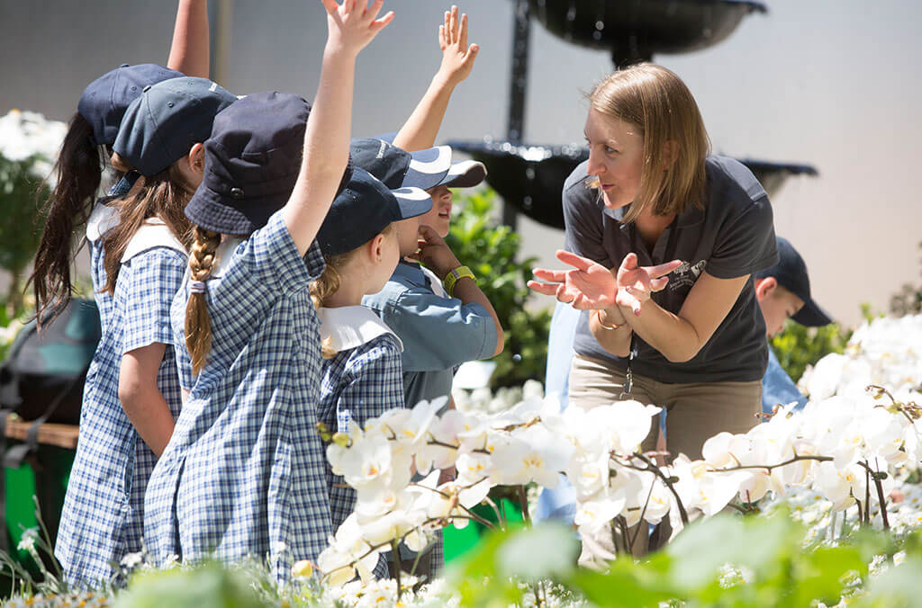Children answering questions on a school tour in the Calyx