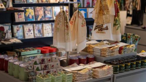 Shelves with garden-inspired gifts, clothing and homewares, including jewellery and scarves