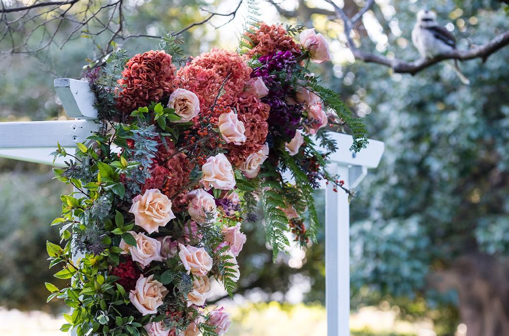 Flower arrangement tied to an arbour